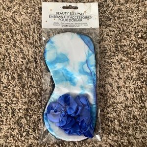 Blue satin eye mask and hair scrunchie. Never used, still in packaging.